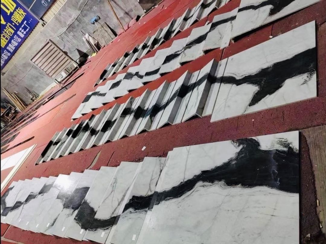 Panda White marble stair pieces and large shaped components laid out before packing