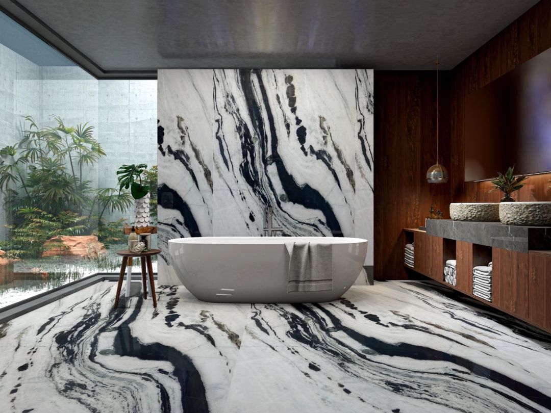 Panda White marble bathroom floor and wall behind a freestanding tub